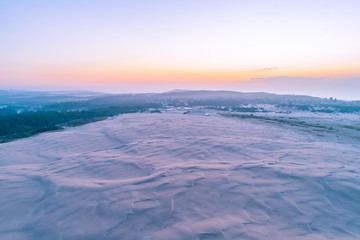 Fototapeta na wymiar Famous white sand dunes near the ocean at dusk. Anna Bay, New South Wales, Australia