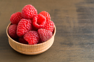 Fresh red raspberries on the table, close up.