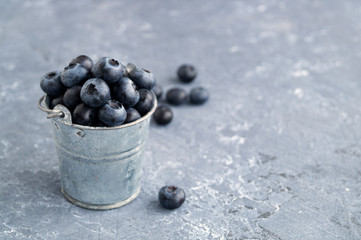 Fresh useful blueberries on a black background.