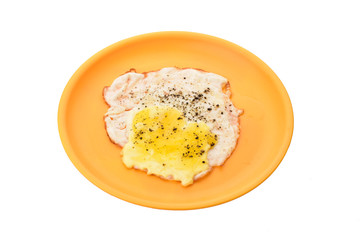 half fry egg with black pepper on top of it isolated on white background, omelette in orage plate
