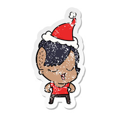 happy distressed sticker cartoon of a girl wearing santa hat