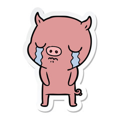 sticker of a cartoon pig crying