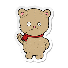 sticker of a cartoon waving teddy bear
