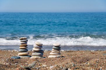 Fototapeta na wymiar Stack of stones on Petra tou Romiou or Aphrodite Rock Beach, Cyprus