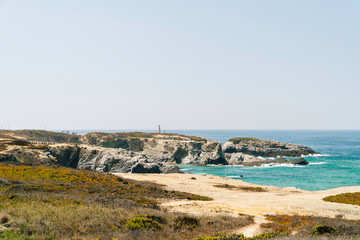 Fototapeta na wymiar Ocean Landscape With Rocks And Cliffs At Lagos Bay Coast In Algarve, Portugal