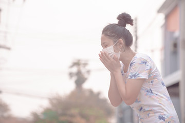 women wearing facial hygienic mask for Safety outdoor. People in masks because of fine dust in thailand. Problems found in major cities around the world. air pollution,Environmental awareness concept