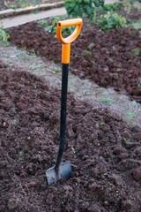 Shovel, garden spade in the ground, soil.
