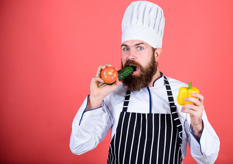 Vegetarian recipe concept. Buy fresh vegetables grocery store. Vegetarian restaurant. Hipster chief chef vegetarian cafe. Choose vegetarian lifestyle. Man cook hat apron hold fresh vegetables