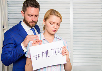 Manager putting his hand on the shoulder of his secretary, at the office. Disrespect. Sexual...