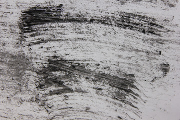 Mascara strokes blurred abstract texture on white background. Cosmetics and beauty products concept backdrop