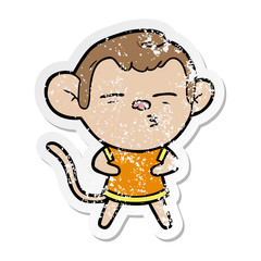distressed sticker of a cartoon suspicious monkey