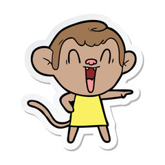 sticker of a cartoon laughing monkey