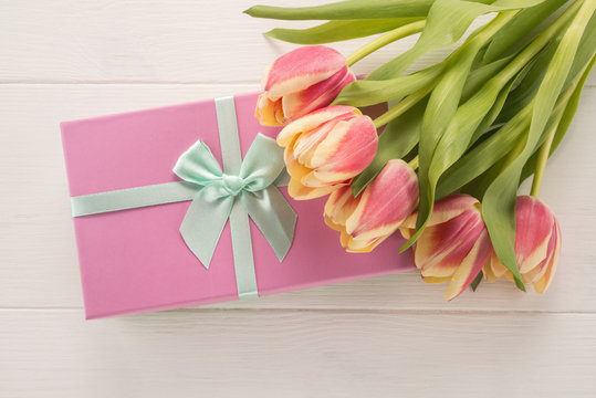 Bunch of spring tulip flowers and gift box  