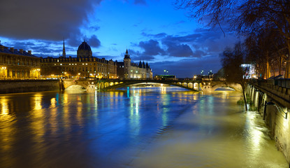 Paris by night. Night view of Paris flood as river Seine rises and approaches record level. January 2018, view from Hotel de Ville at Ile de la Cite