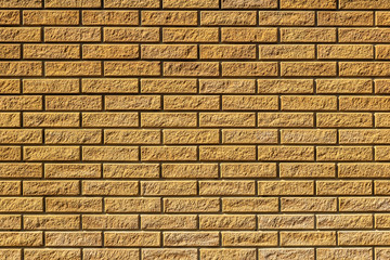 Texture of a  yellow brick wall background
