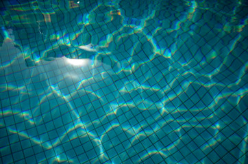 Blue rippled water in a swimming pool on a sunny day