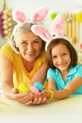 Senior grandmother and granddaughter with  Easter eggs