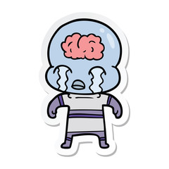 sticker of a cartoon big brain alien crying