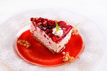fresh cake pastry  tuck with barries on plate