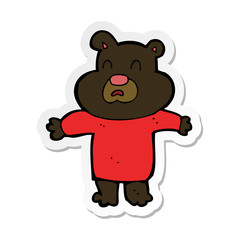 sticker of a cartoon unhappy black bear