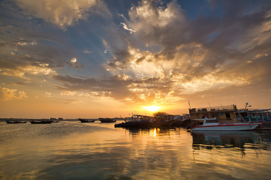 Amazing sunset in Wakra port with botas and tradional dhows