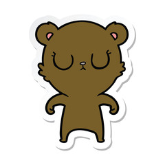 sticker of a peaceful cartoon bear
