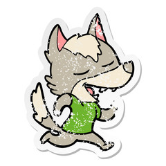 distressed sticker of a cartoon running wolf laughing