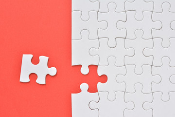 Jigsaw puzzle on a red background 
