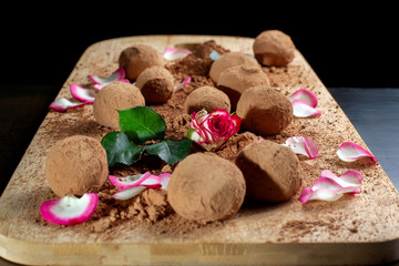 Homemade chocolate and nuts candy balls with cocoa powder.