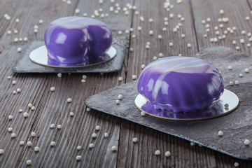 French mousse cake covered with mirror glaze