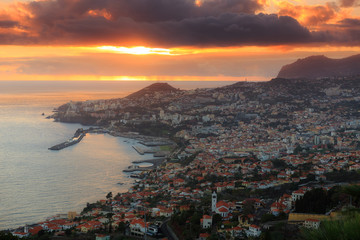 Fototapeta na wymiar Beautiful skyline cityscape aerial view from the hill of the city Funchal on the island Madeira at sunset in summer