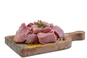 Fresh pieces of raw veal meat for French Blanquette. Image isolated on white studio background.