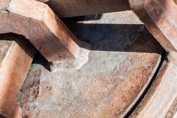 Rusted metal cover in sun closeup