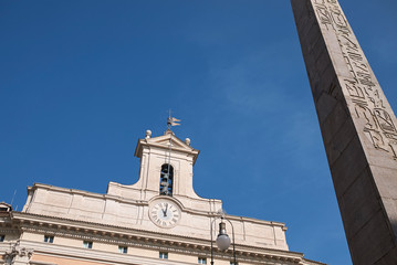 Roma, Italy - February 09, 2019 : View of the Montecitorio obelisk and Palazzo Montecitorio on the...