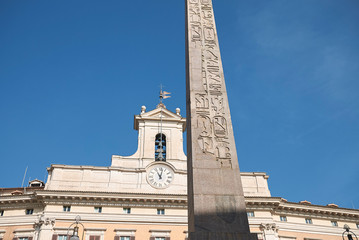 Roma, Italy - February 09, 2019 : View of the Montecitorio obelisk and Palazzo Montecitorio on the...
