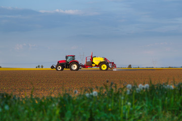Fototapeta premium tractor working in field agriculture