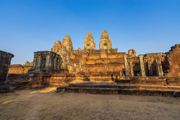 Pyramid and sanctuaries of Pre Rup temple, Cambodia: view through the first enclosure wall
