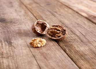 walnuts on a rustic wooden table - close up