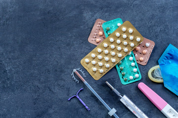 Choosing method of contraception : Birth control pills, an injection syringe, condom, IUD-method,...