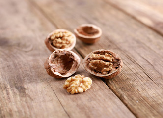 walnuts on a rustic wooden table - close up