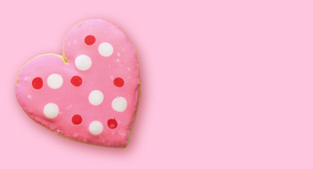 Heart-shaped cookies on a pink background