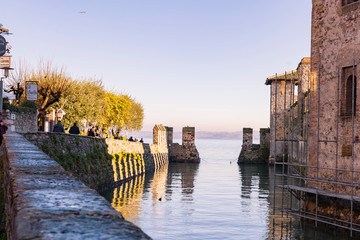 Ancient castle in Italy and lake. Travel and tourism in evroppe. Free space for text. Castle in the...