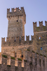 Castle in the north of Italy near the lake. Ancient castle and blue sky. Travel in Europe and tourism. Free space for text.