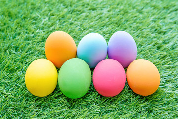 Fototapeta na wymiar Colorful Easter eggs on green grass