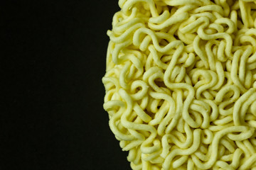 The Instant noodle on black ceramic plate close up. - Powered by Adobe