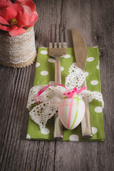 Easter table setting with daffodil and cutlery. Holidays background