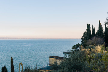 Ancient castle in Italy and lake. Travel and tourism in evroppe. Free space for text. Castle in the...