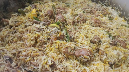 A close up  view of cooked rice chicken biryani made with traditional recipe
