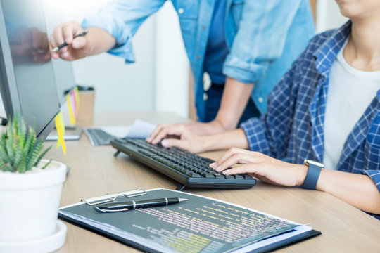 IT office Programmers software development coding technologies On Computer working in a company office