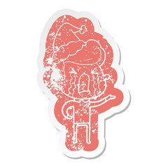 cartoon distressed sticker of a crying man wearing santa hat